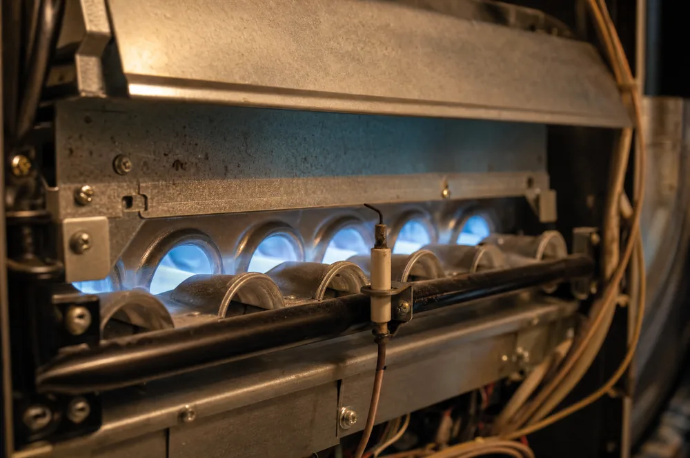 Clean blue burner flames in a gas furnace